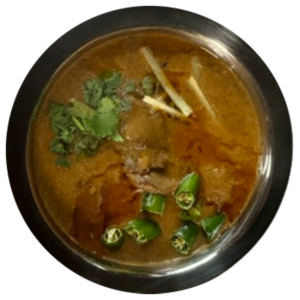 Beef Nihari served in steel bowl with ginger , chilli , and coriander topping