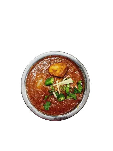 A dish of chicken tikka masala with garnishing on top