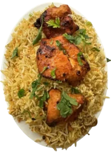 A dish of chicken tikka biryani with cilantro on top