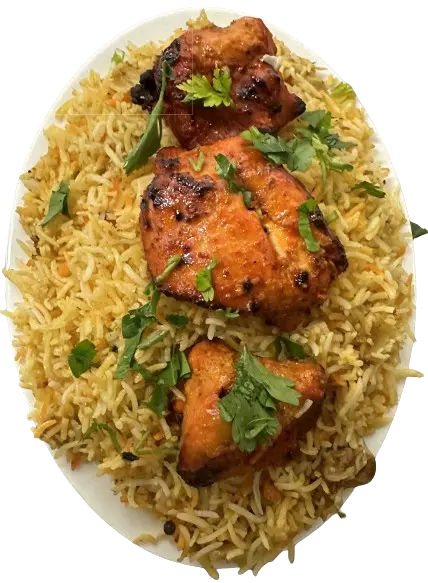 a serving of chicken tikka biryani with cilantro on top