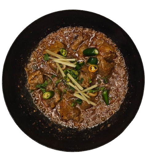 Dish Of Goat Peshawari Karahi with chillies and ginger topping