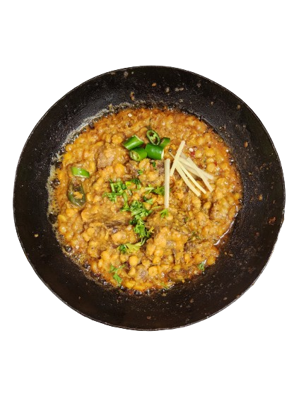 A dish of chana daal gosht with ginger and chillies garnishing