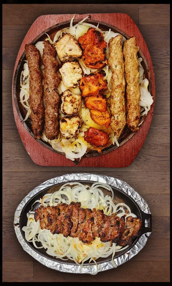 BBQ Platter serving malai boti, chicken tikka , beef seekh kabab and chicken kabab accompanied by a dish of bihari kabab.