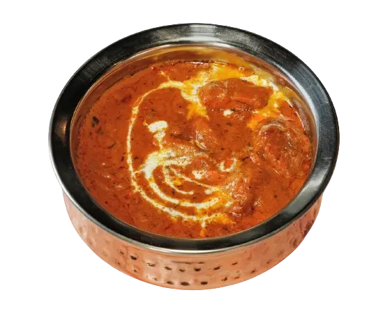 Scrumptious butter chicken in a steel bowl, topped with a swirl of creamy butter sauce.