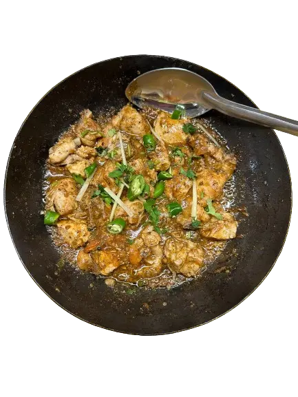 A Dish Of Chicken Charsi Karahi with chillies and ginger on top