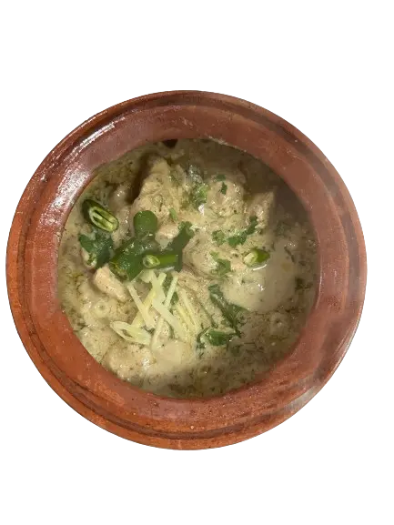 chicken multani handi with fresh garnishing served in clay pots