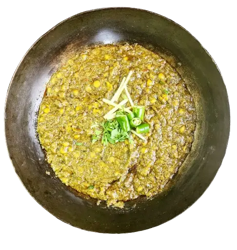 A karahi of dal Palak, with ginger and chilies' garnishing