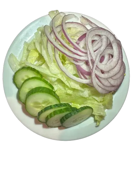 A plate of crisp salad featuring onions, iceberg lettuce, and cucumber slices.