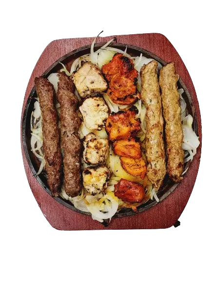 A BBQ platter featuring two seekh kebabs, two chicken seekh kebabs, two malai boti, and two chicken tikka boti.