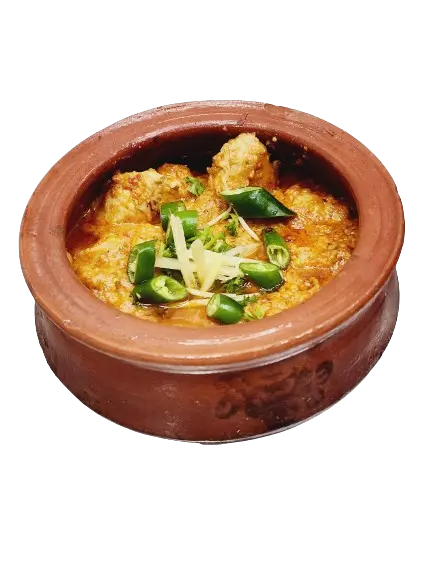 chicken makhni handi with fresh garnishing in mud handi