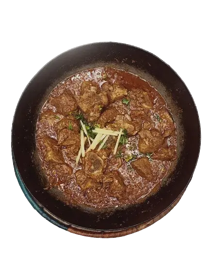 flavorful dish of peshawari goat karahi with garnished ginger and chillies