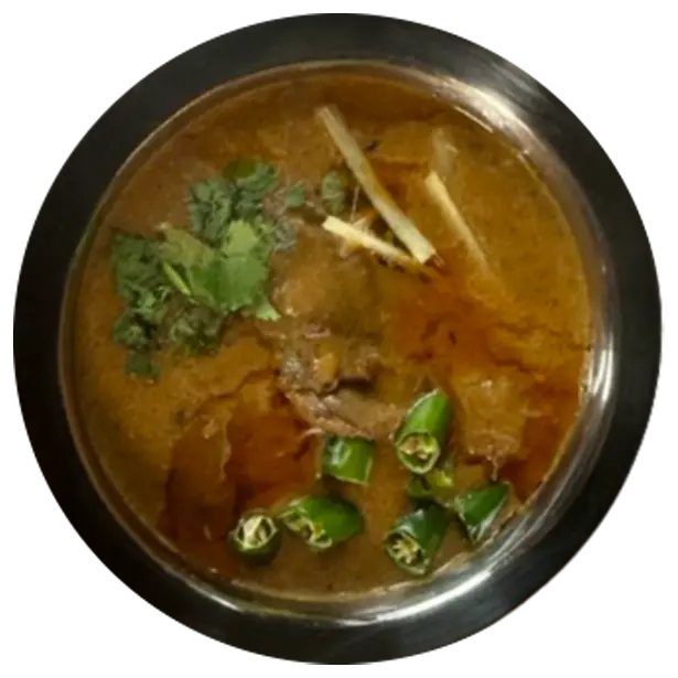 A dish of beef nihaari with mix garnishing