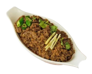 Tawa Qeema Beef, adorned with slices of chili and ginger, elegantly presented in a cylindrical dish.
